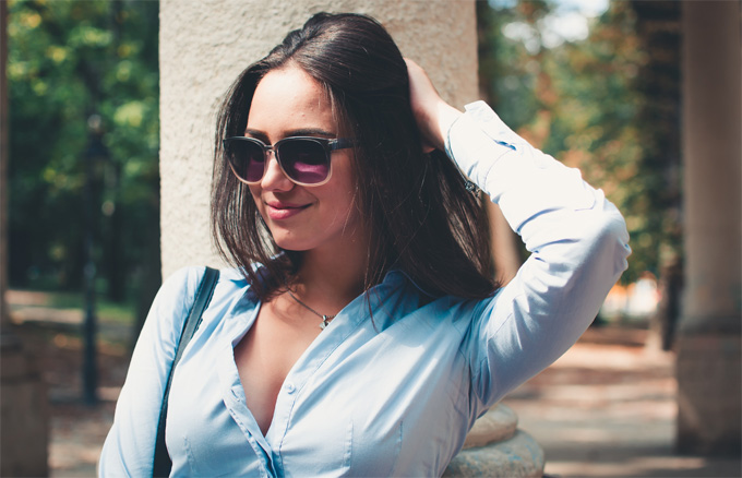 A photo of a Ukrainian woman wearing a blue long-sleeved top.