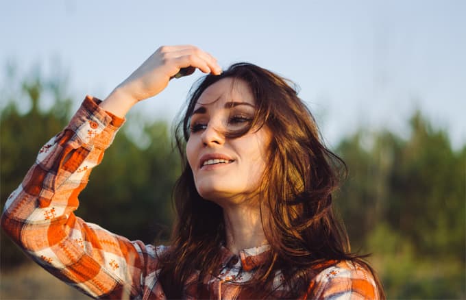 A woman touching her hair